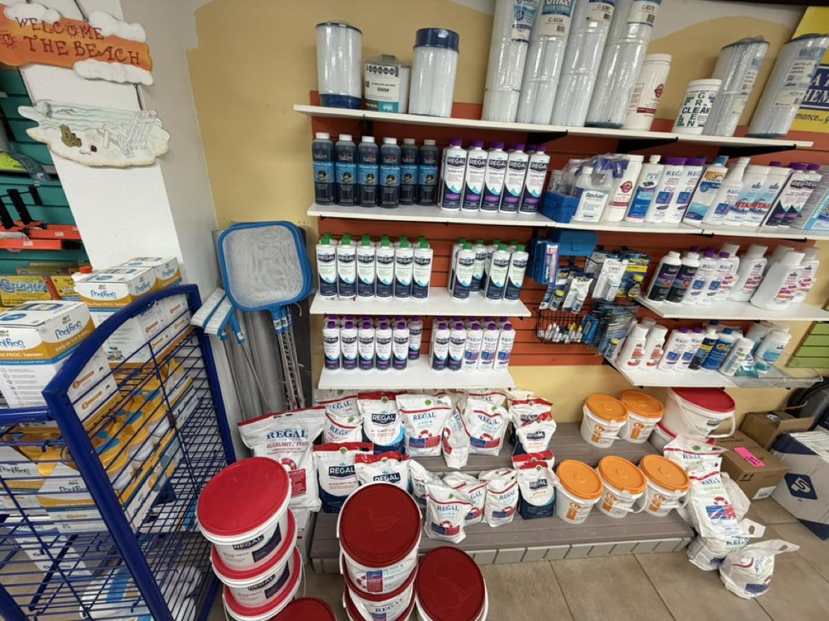 Regal pool chemicals, shock, and balancers on shelves at Heartland Pool Store in Hartland WI